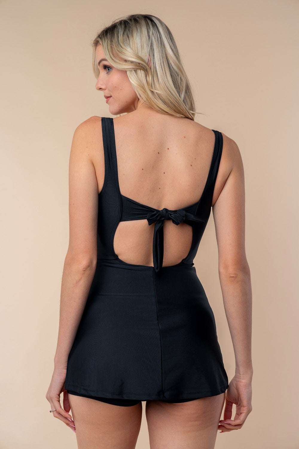 White Birch full size sleeveless tie back performance knit swim dress with keyhole design.