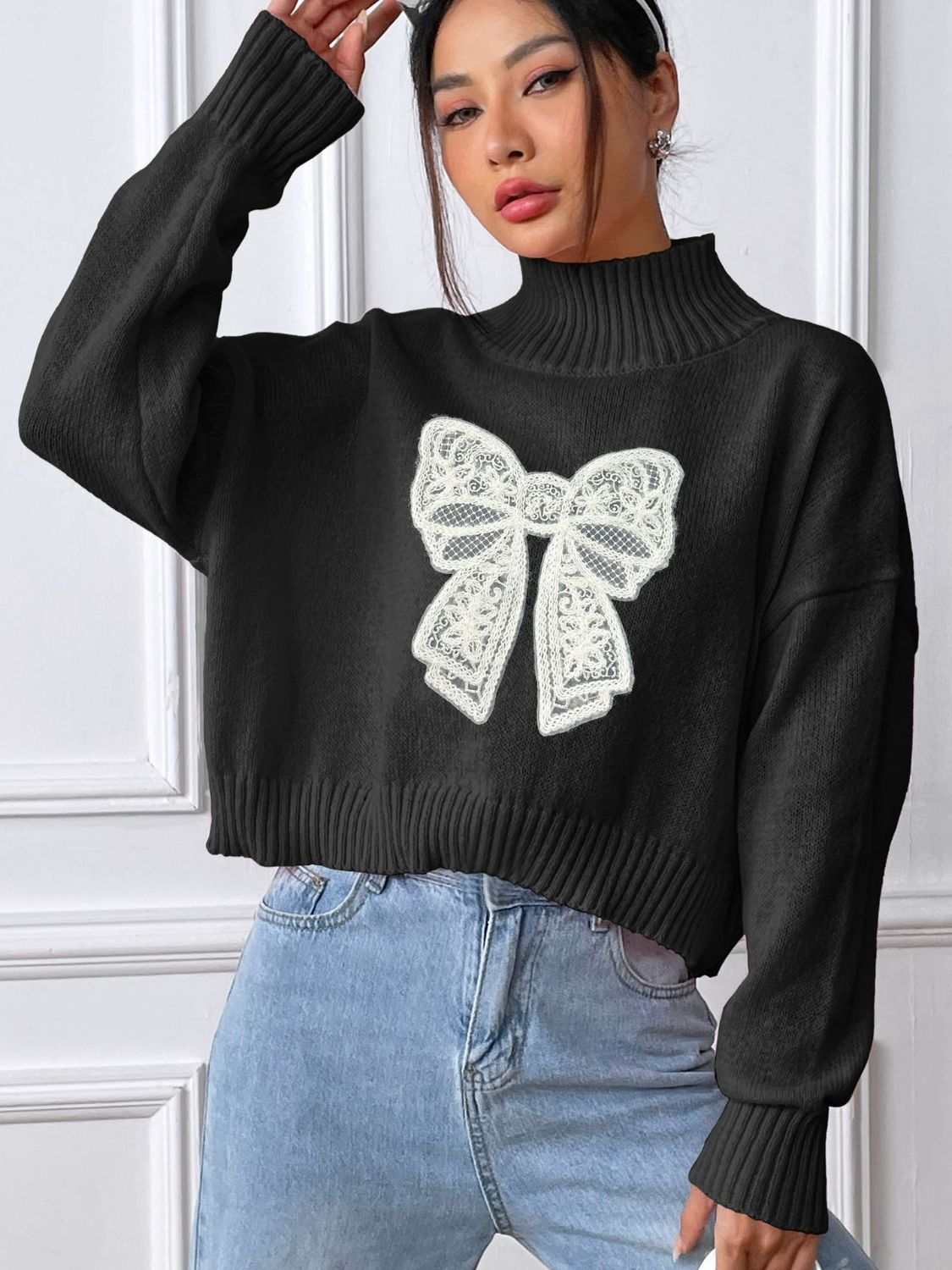 Bow Turtleneck Long Sleeve Sweater with white bow design, slightly stretchy, polyester.