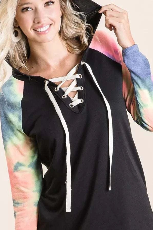 BiBi French Terry hoodie with black body, lace-up detail, and colorful tie-dye sleeves.