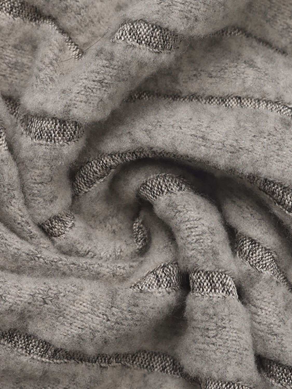 Close-up of the fabric texture for the Perfee Drawstring Long Sleeve Hoodie in gray.