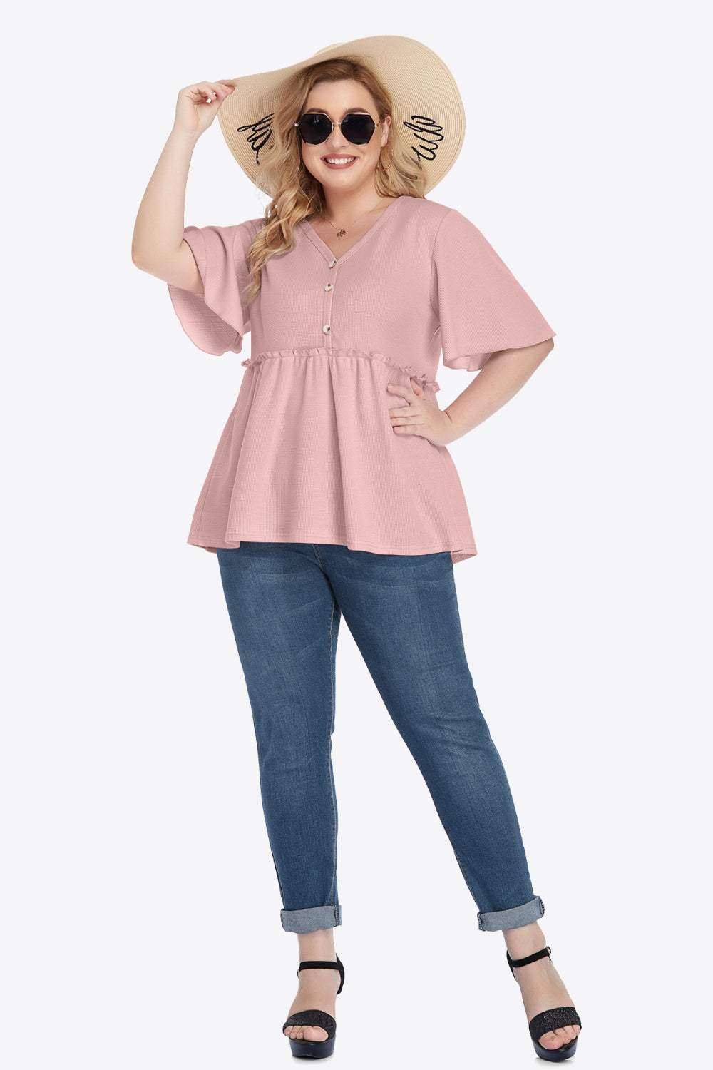 Plus size V-neck frill trim babydoll blouse with button detail, half flutter sleeves, and solid pattern.