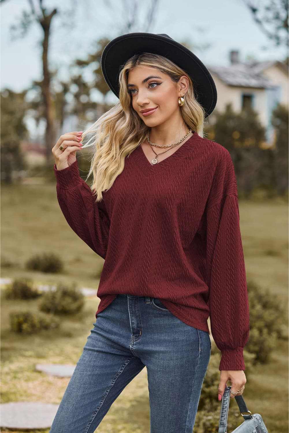 V-Neck Dropped Shoulder Blouse in burgundy, casual style, long sleeves, worn by model outdoors.