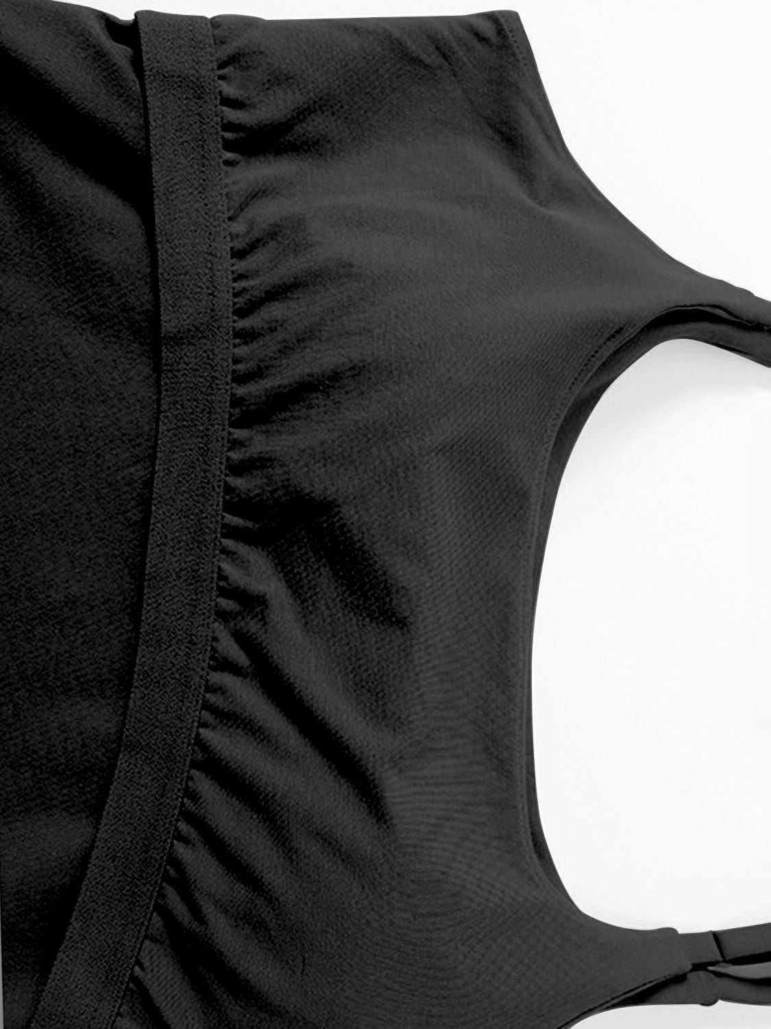 Scoop neck cropped cami with chest pads in black, featuring a basic style and highly stretchy material.