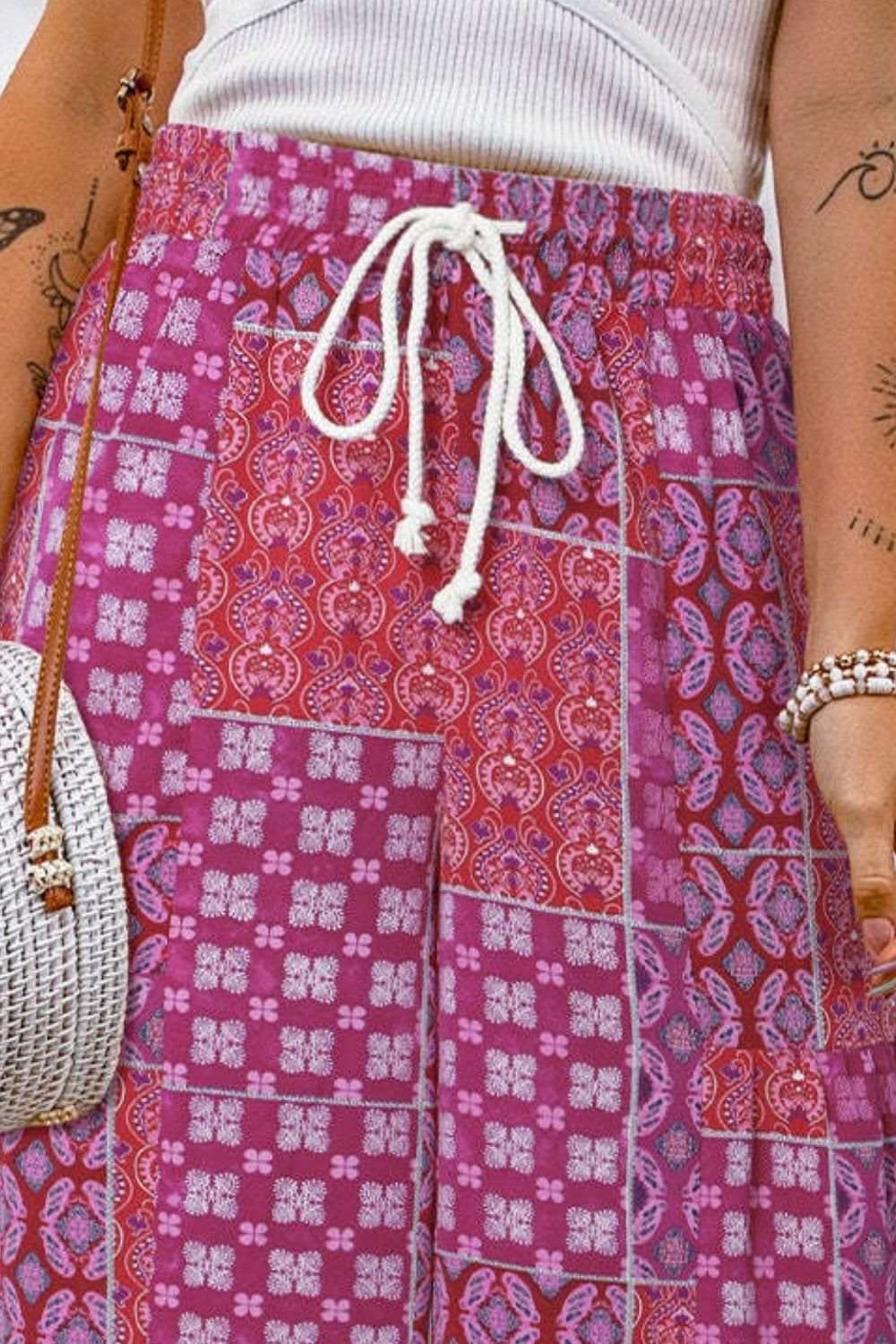 Full Size Drawstring Printed Wide Leg Pants in vibrant colors with a white drawstring detail.