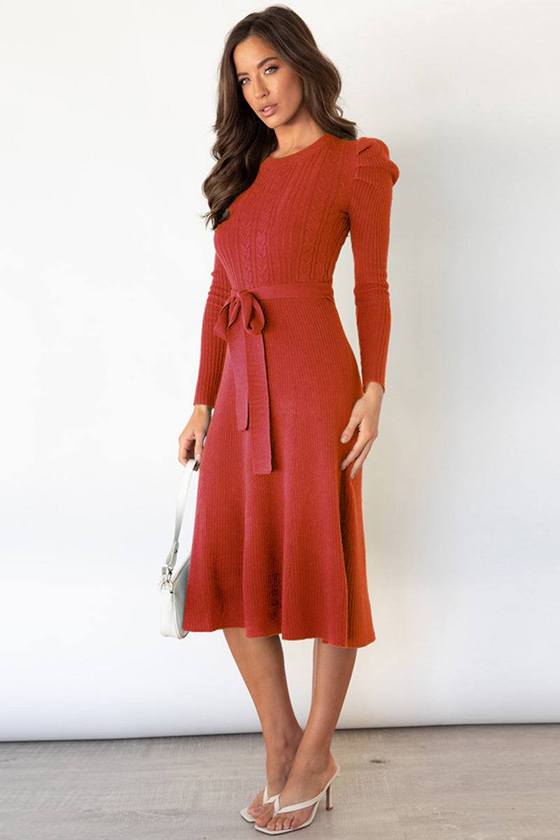 Round neck long sleeve tie waist sweater dress in rust color, highly stretchy, made of 95% polyester and 5% spandex.