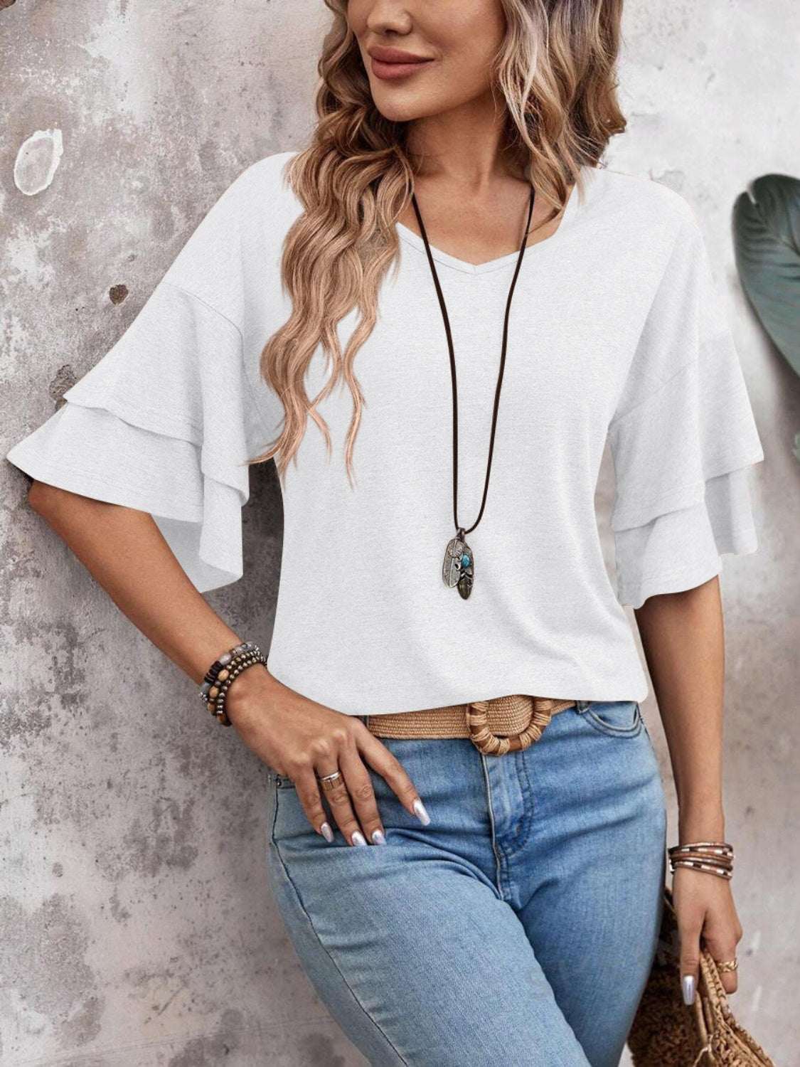 V-Neck half sleeve blouse in white with layered sleeves and casual fit.