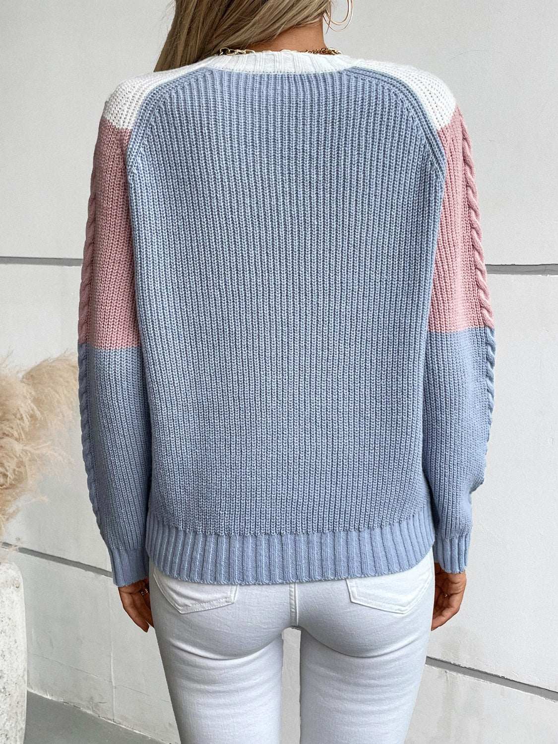 Color block round neck long sleeve sweater in blue, pink, and white.