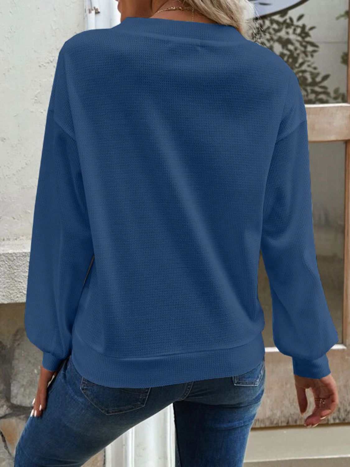 Solid casual V-neck dropped shoulder blouse with long sleeves.