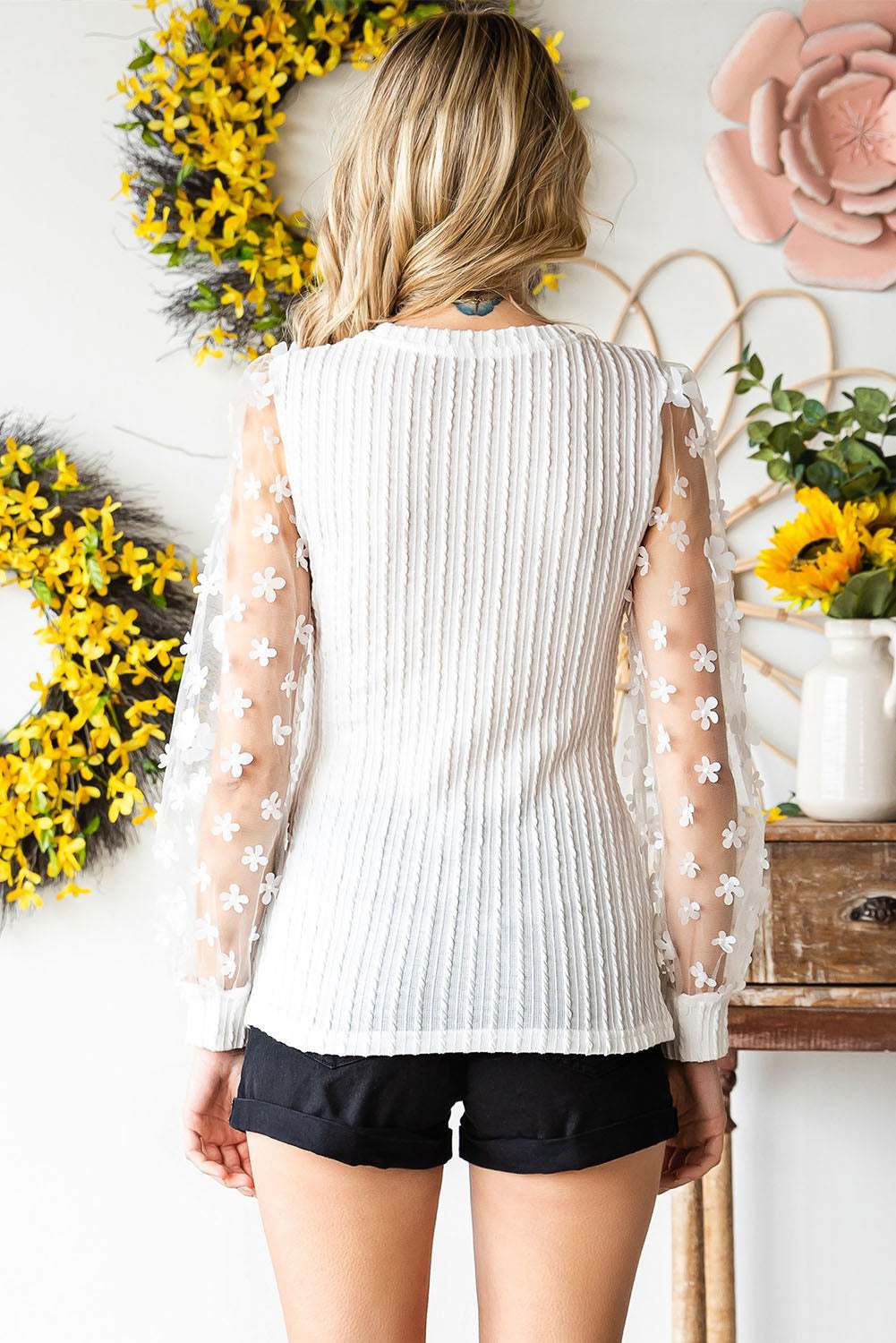 Textured applique long sleeve blouse with cable-knit and round neck, featuring solid color and slightly stretchy material.