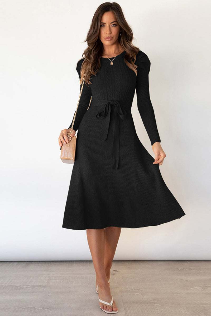 Round neck long sleeve tie waist sweater dress in black.
