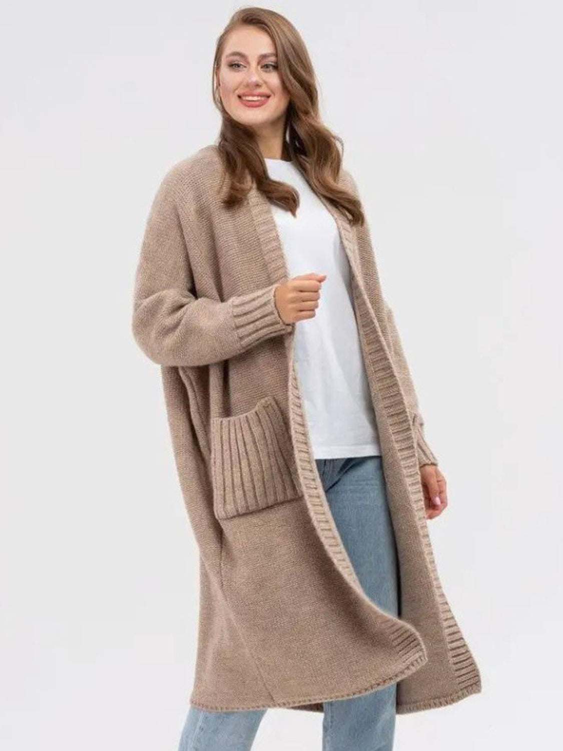 Pocketed open front long sleeve longline cardigan in beige with pockets and moderate stretch.