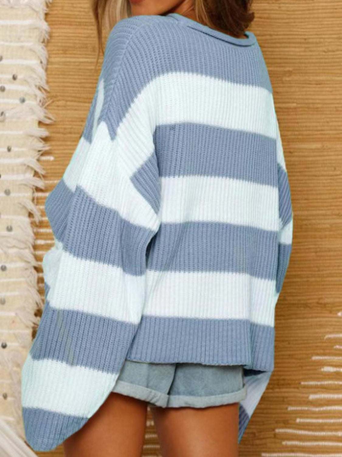 Round neck long sleeve sweater with blue and white stripes, slightly stretchy, made of 100% polyester.