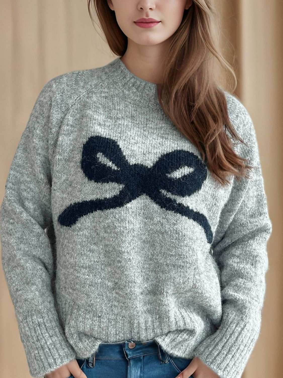 Bow Round Neck Long Sleeve Sweater with basic style, slightly stretchy material, and a bow design.