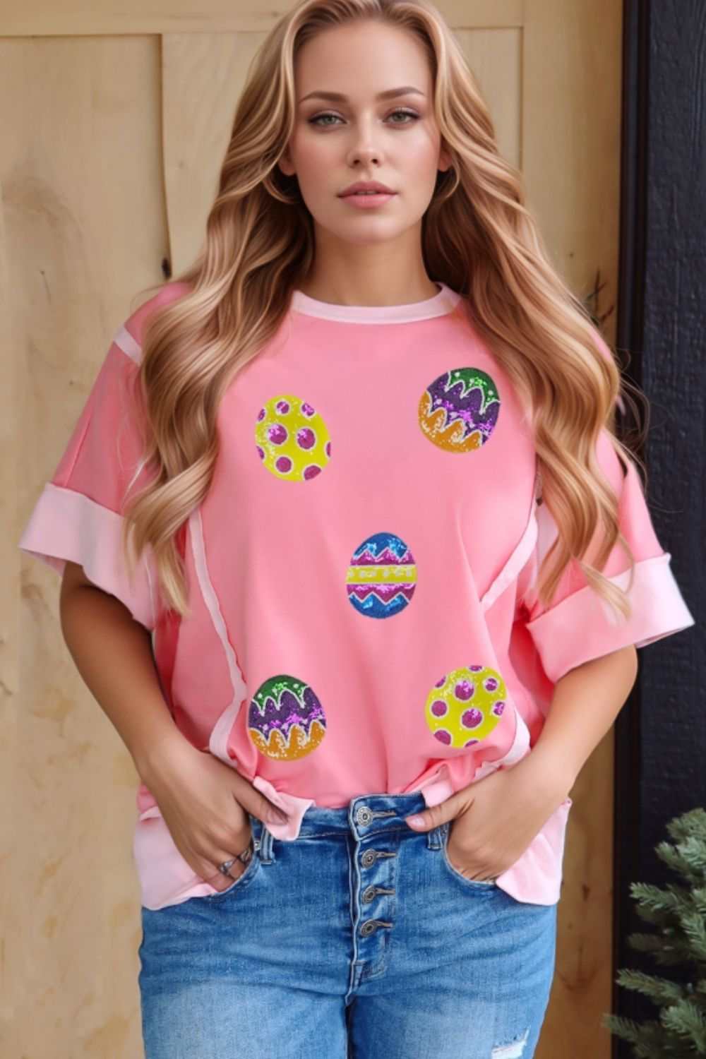 Pink short sleeve t-shirt with sequined Easter egg design.
