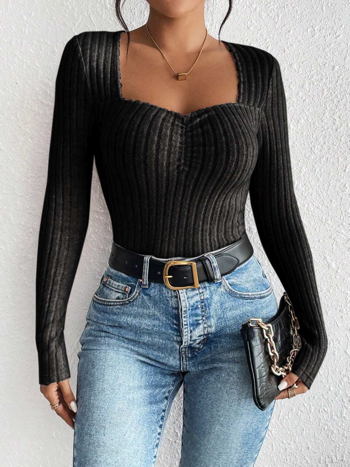 Honey Ribbed Long Sleeve T-Shirt, slightly stretchy, black, paired with jeans and a black belt.