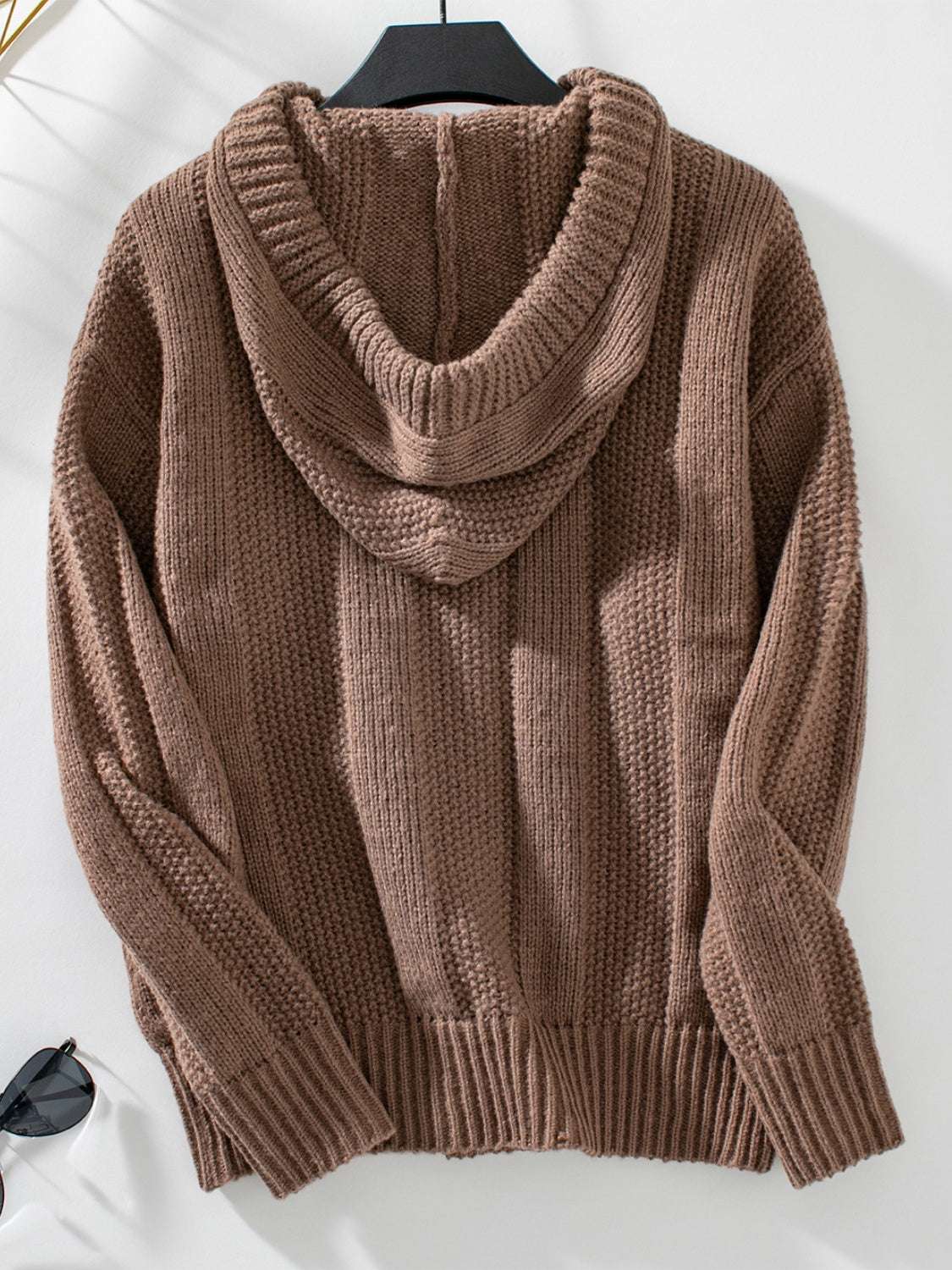 Drawstring long sleeve hooded sweater in brown, featuring decorative button detail and slightly stretchy polyester.