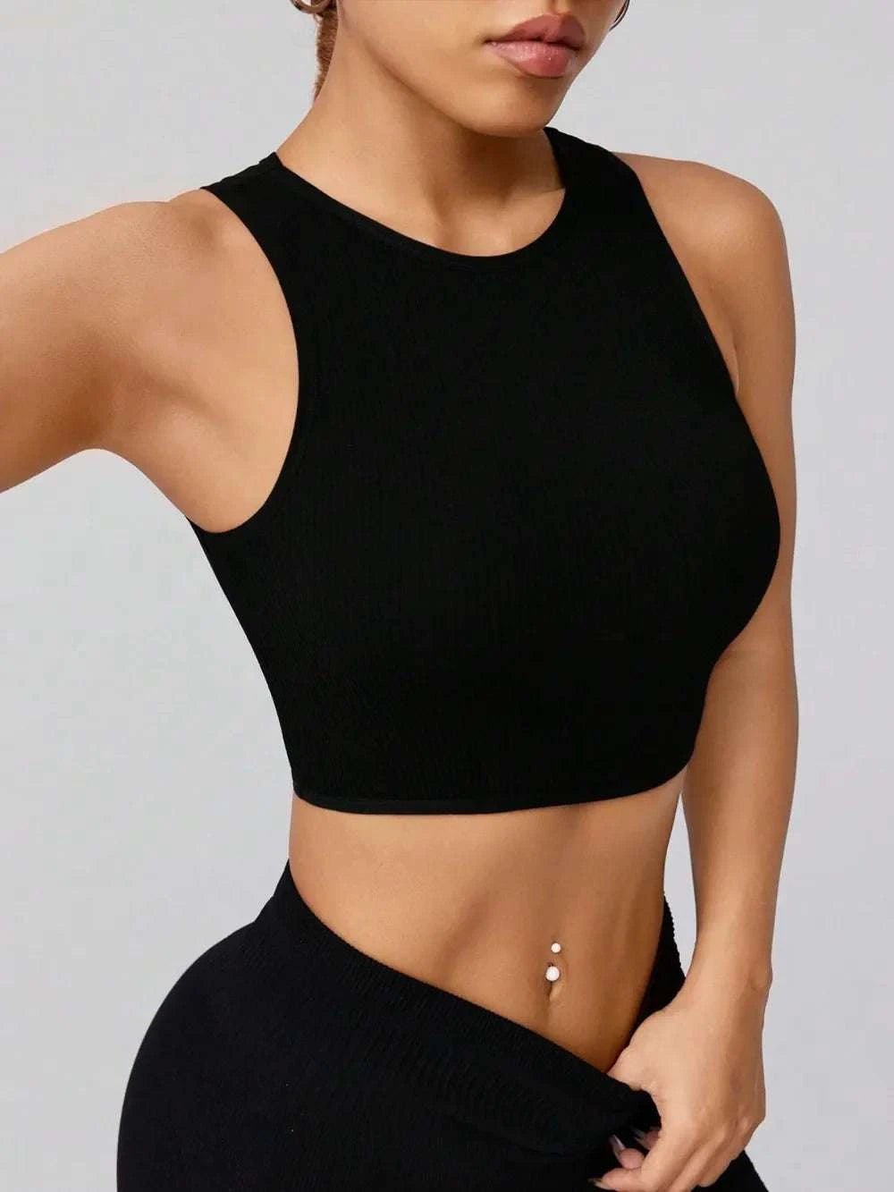 Round neck active tank in black with moderate stretch fabric.