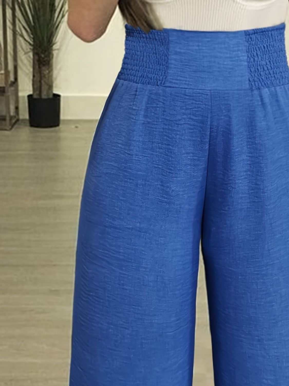 Plus size high waist wide leg blue pants for women.