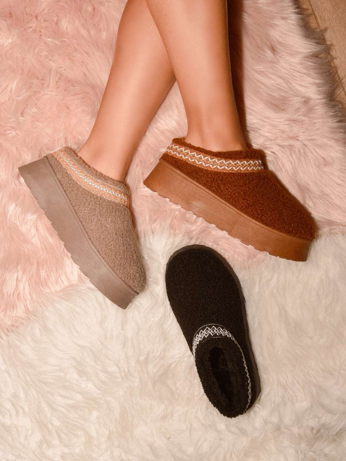 WILD DIVA Embroidered Trim Platform Sherpa Boots on pink and white shag rugs.