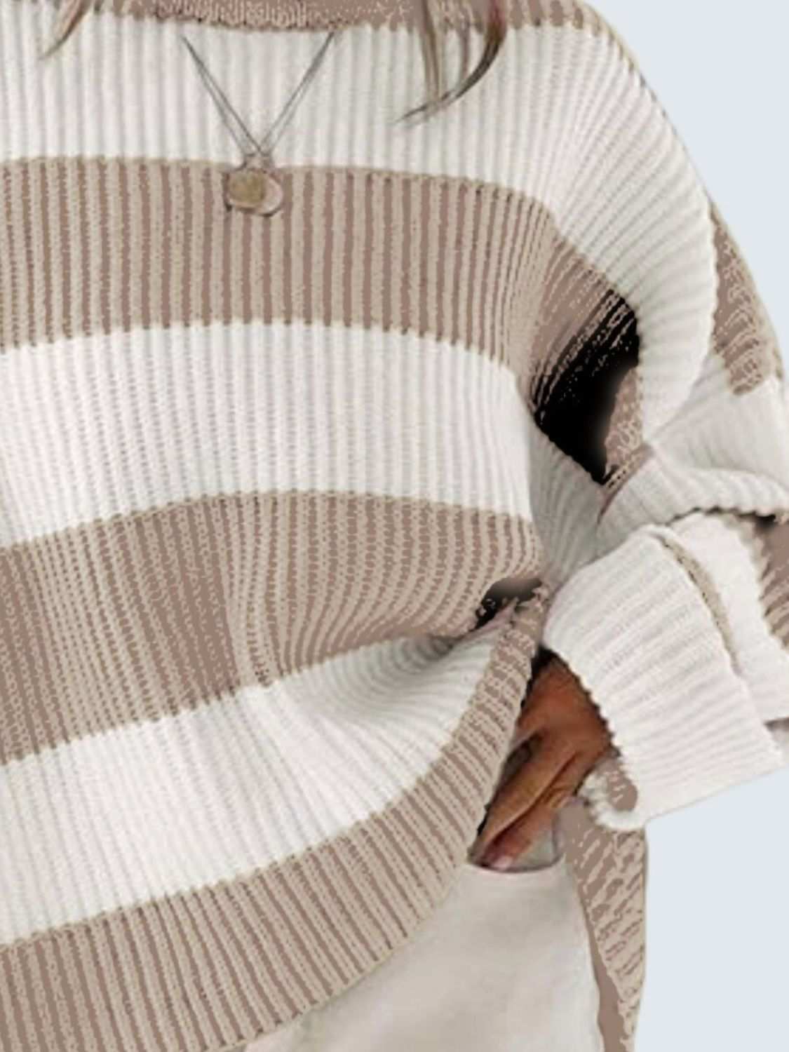 Round neck long sleeve sweater in beige and white stripes.