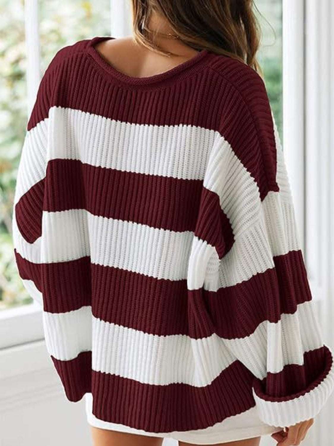 Round neck long sleeve sweater in burgundy and white stripes, slightly stretchy polyester.