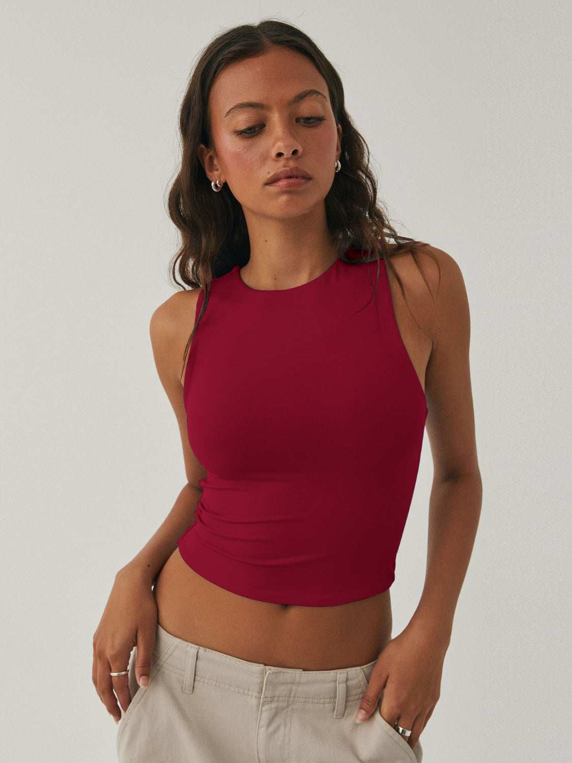 Women's red round neck cropped tank, slightly stretchy polyester blend.
