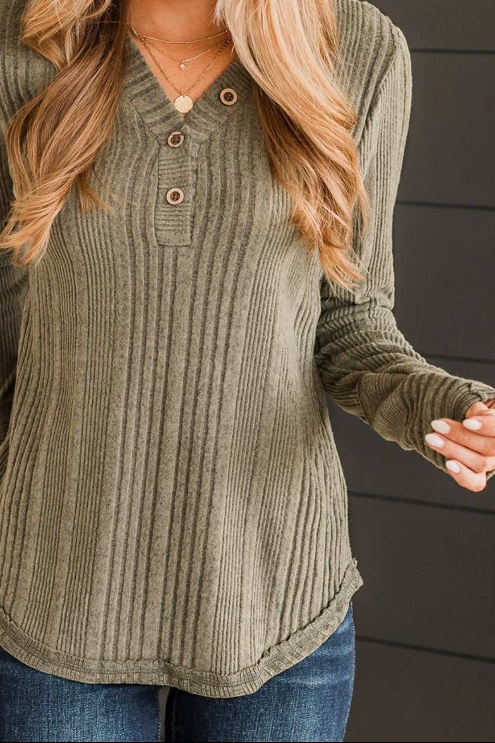 Ribbed buttoned long sleeve blouse in green with a slightly stretchy material.