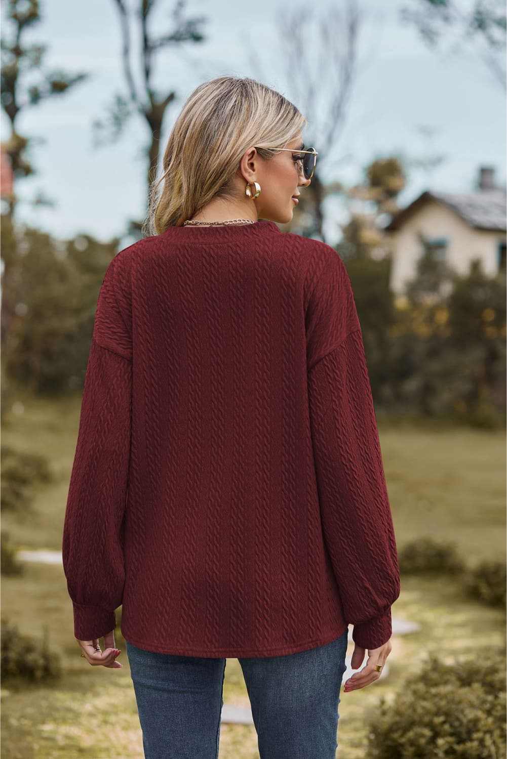 Casual V-neck dropped shoulder blouse with long sleeves in solid color, shown from the back.