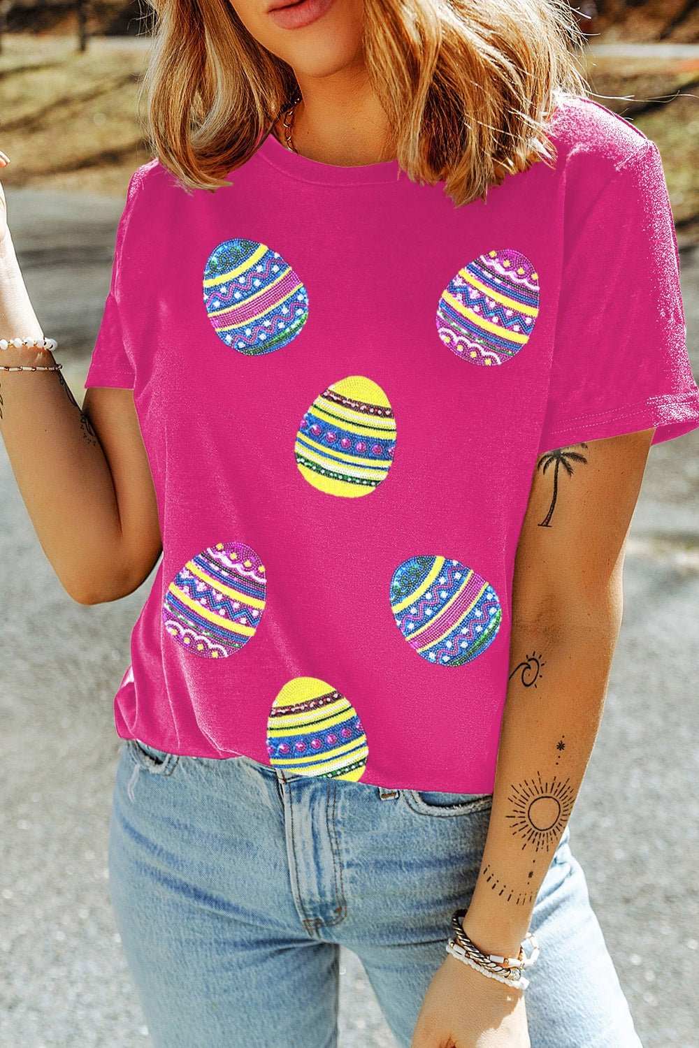 Pink short sleeve t-shirt with sequin Easter egg design.