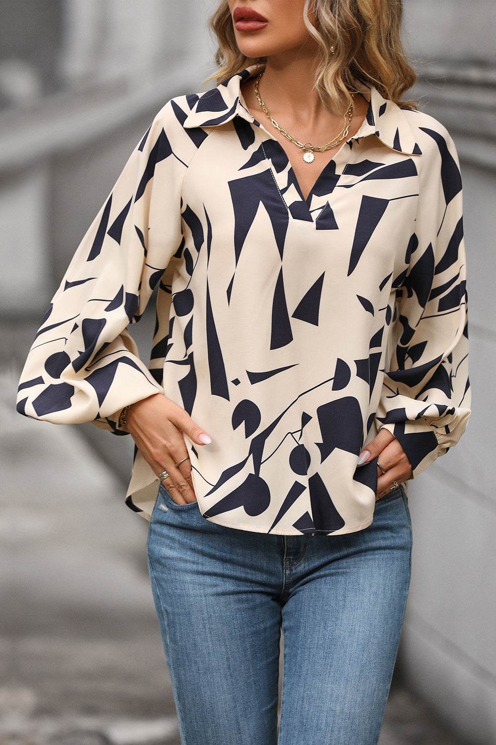 Perfee Printed Johnny Collar Blouse in abstract pattern, worn casually with jeans.