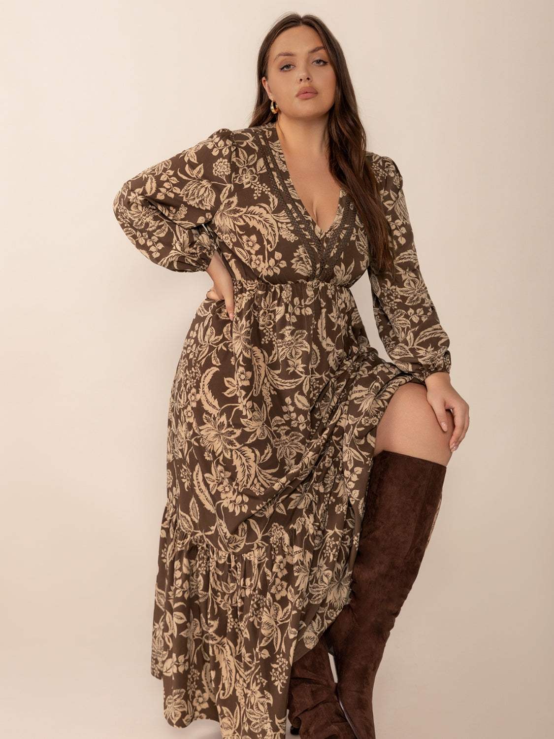 Plus size printed V-neck balloon sleeve maxi dress in brown pattern.