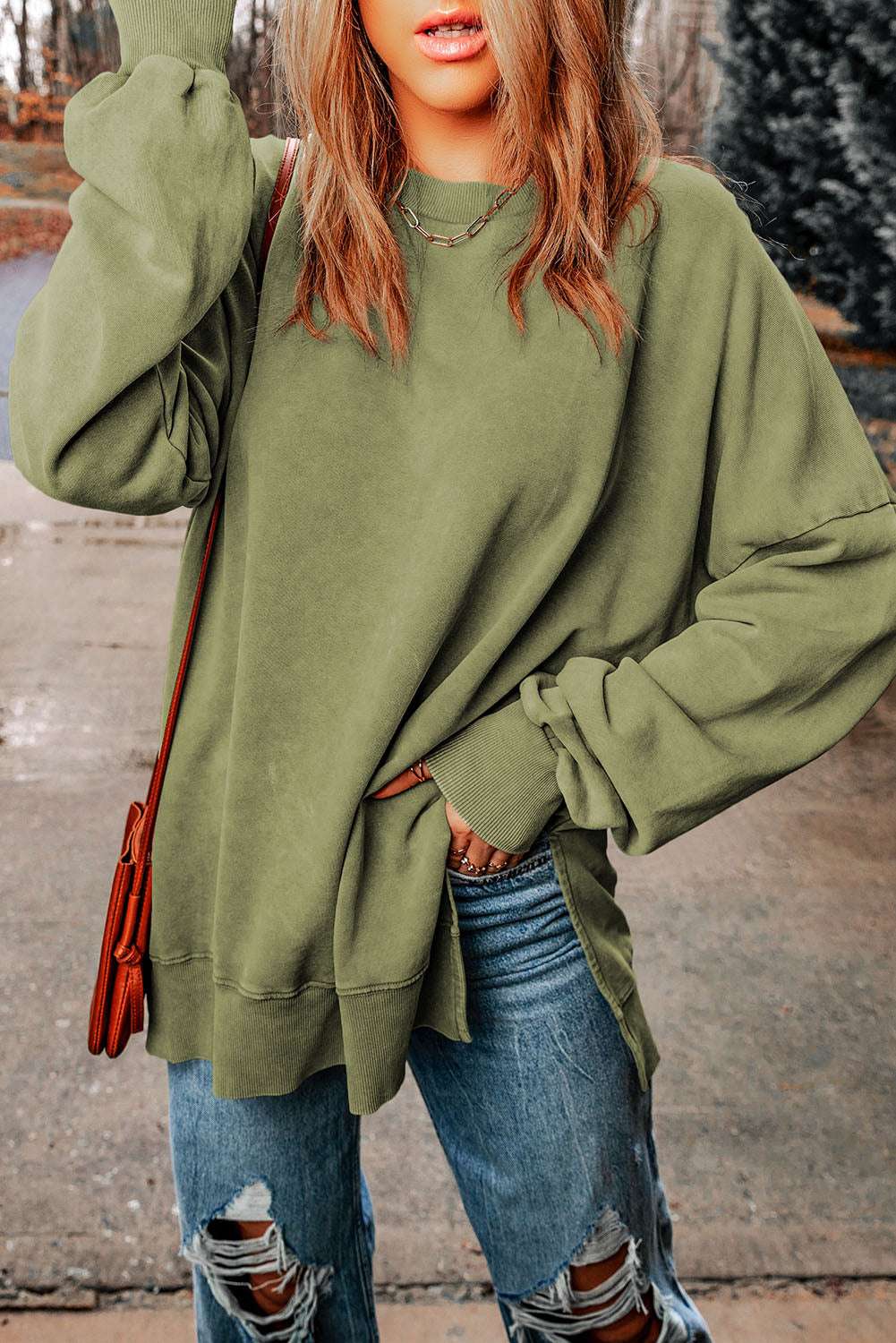 Casual dropped shoulder round neck long sleeve blouse in solid color.