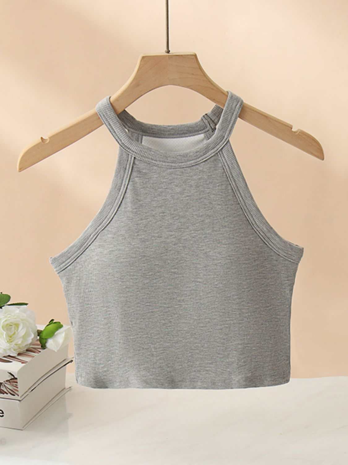 Ribbed Grecian neck cropped tank top with chest pads, highly stretchy viscose blend.