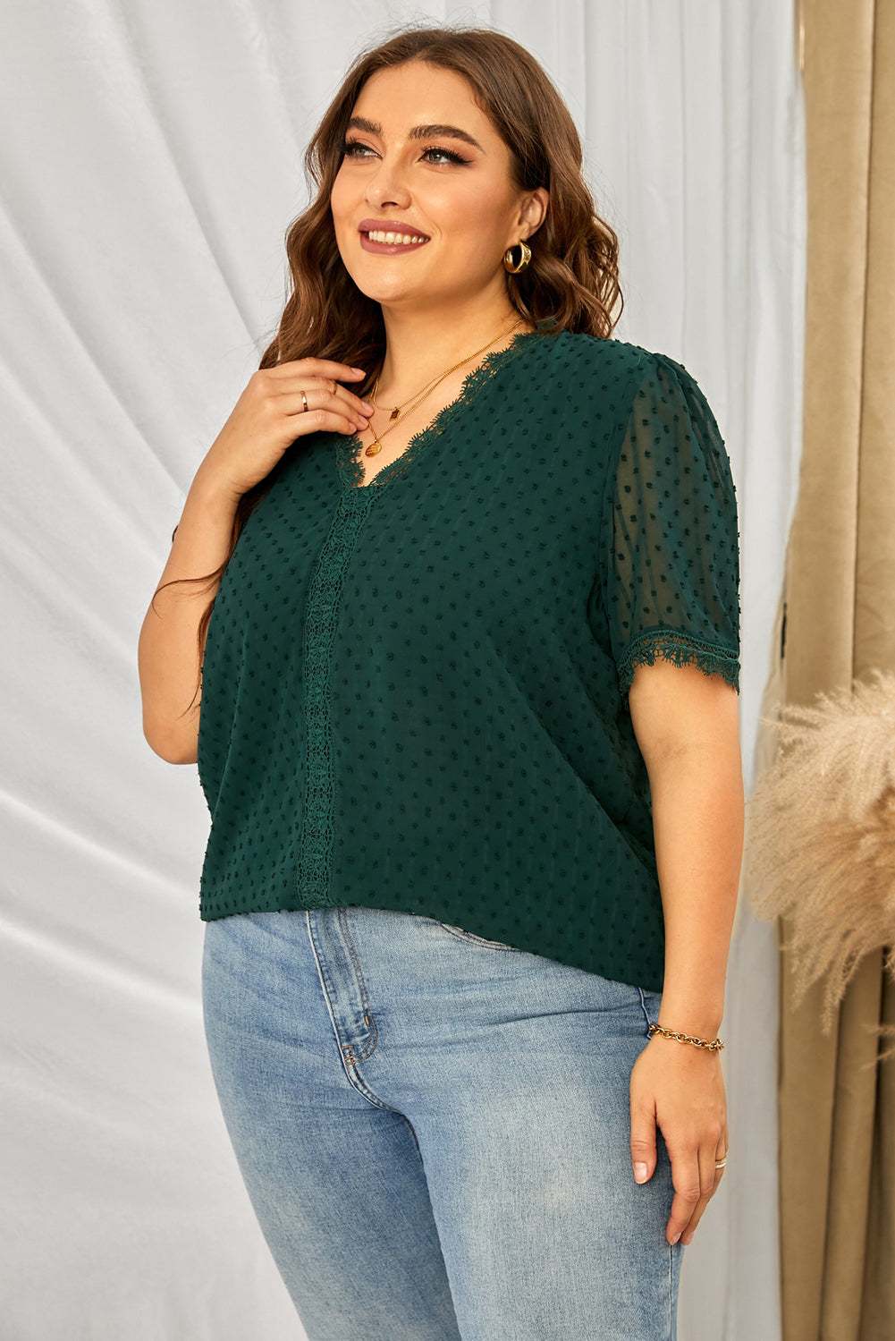 Plus size V-neck blouse with Swiss dot and lace detail, short sleeves.