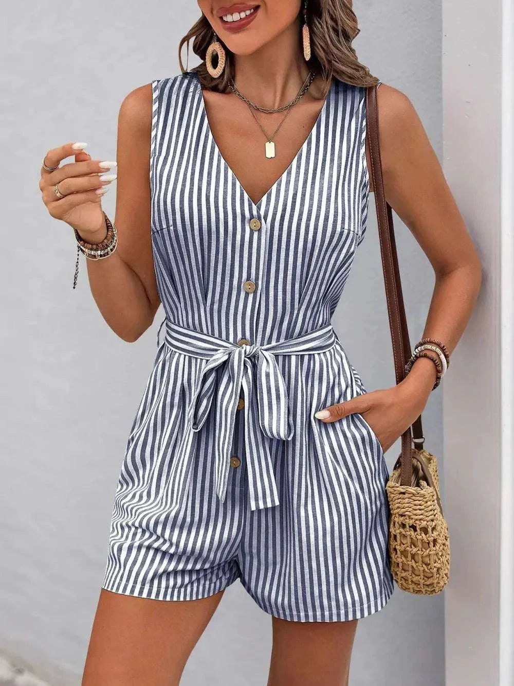 Perfee Striped V-Neck tie waist romper with pockets in blue and white vertical stripes, sleeveless, button front design, casual summer outfit