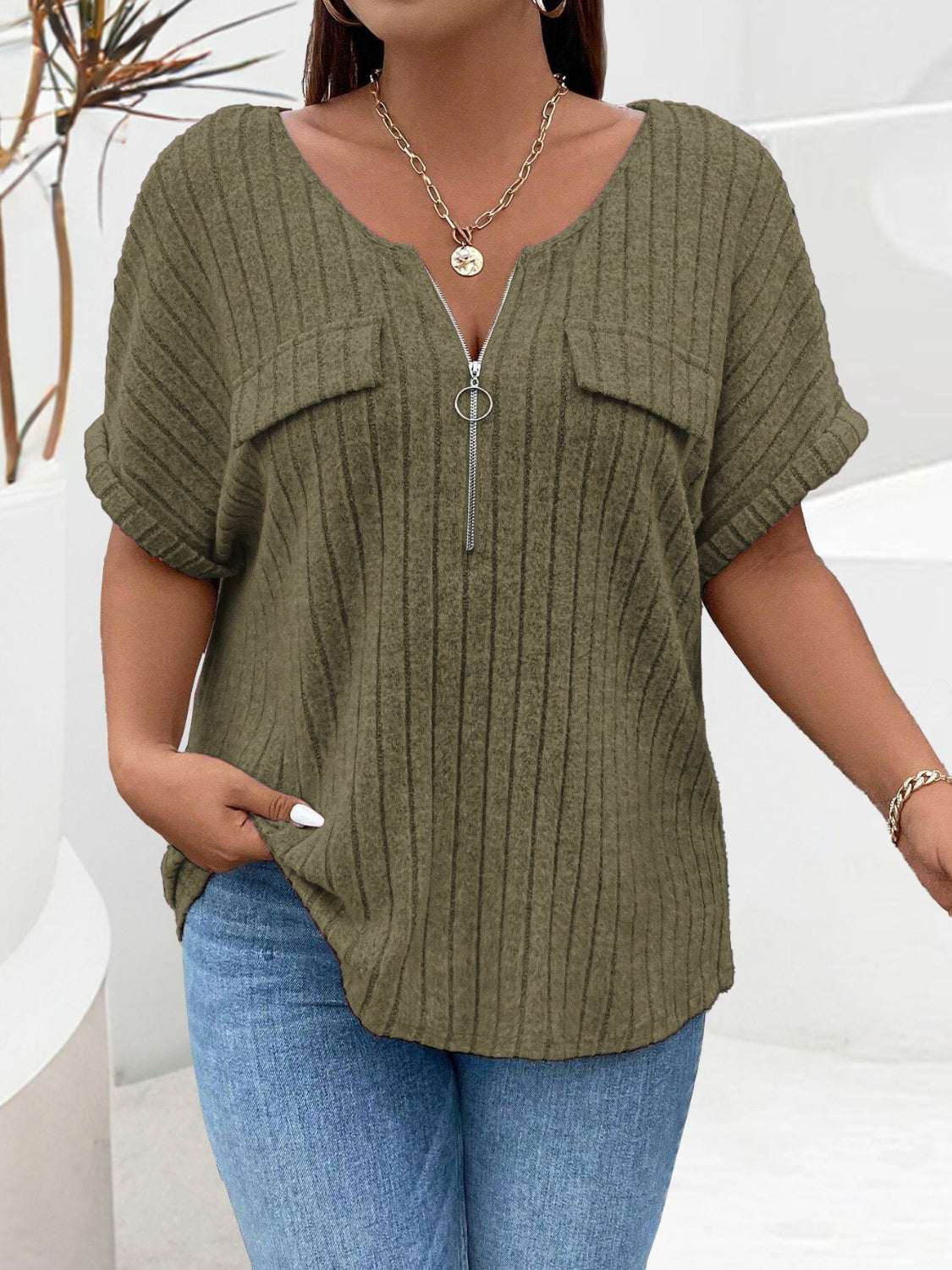 Plus size half zip short sleeve T-shirt in olive green with ribbed texture.