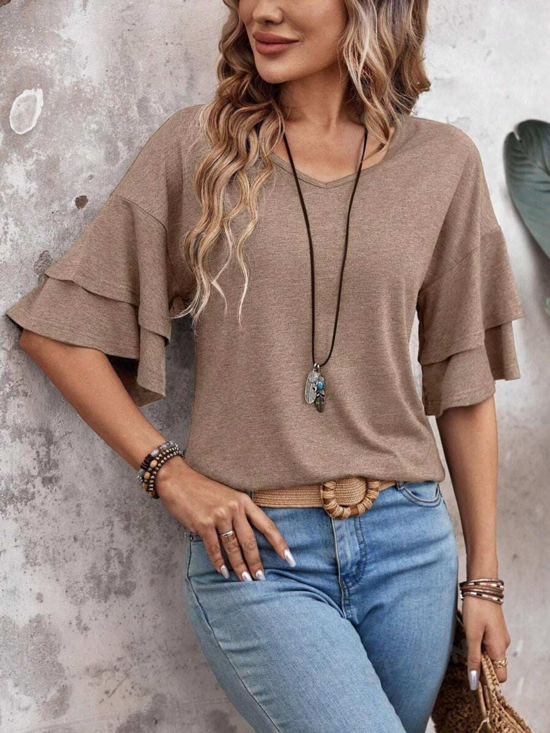 V-Neck half sleeve blouse in light brown with layered ruffle sleeves, worn by a model.