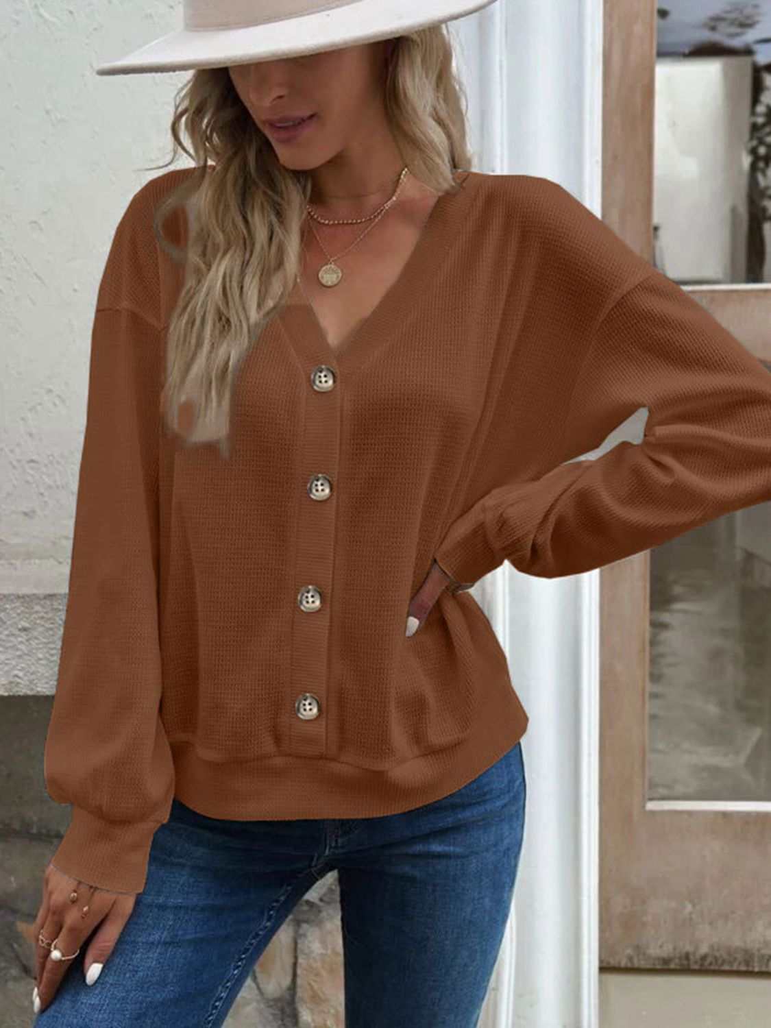 Casual solid V-neck dropped shoulder blouse with long sleeves in waffle-knit texture.