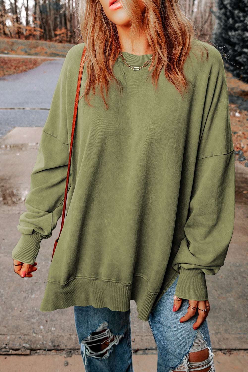 Dropped shoulder round neck long sleeve blouse in solid casual style.