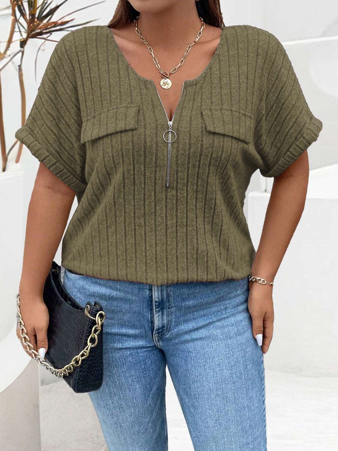 Plus size half zip short sleeve T-shirt in olive green with ribbed texture.