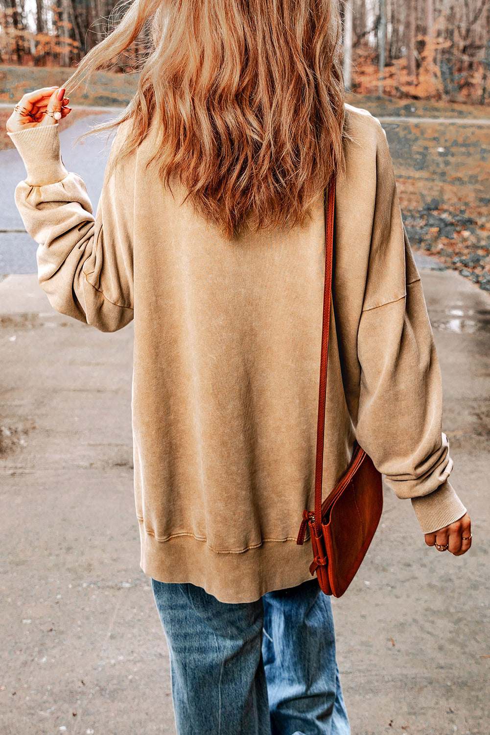 Dropped shoulder round neck long sleeve blouse in solid color, casual style.