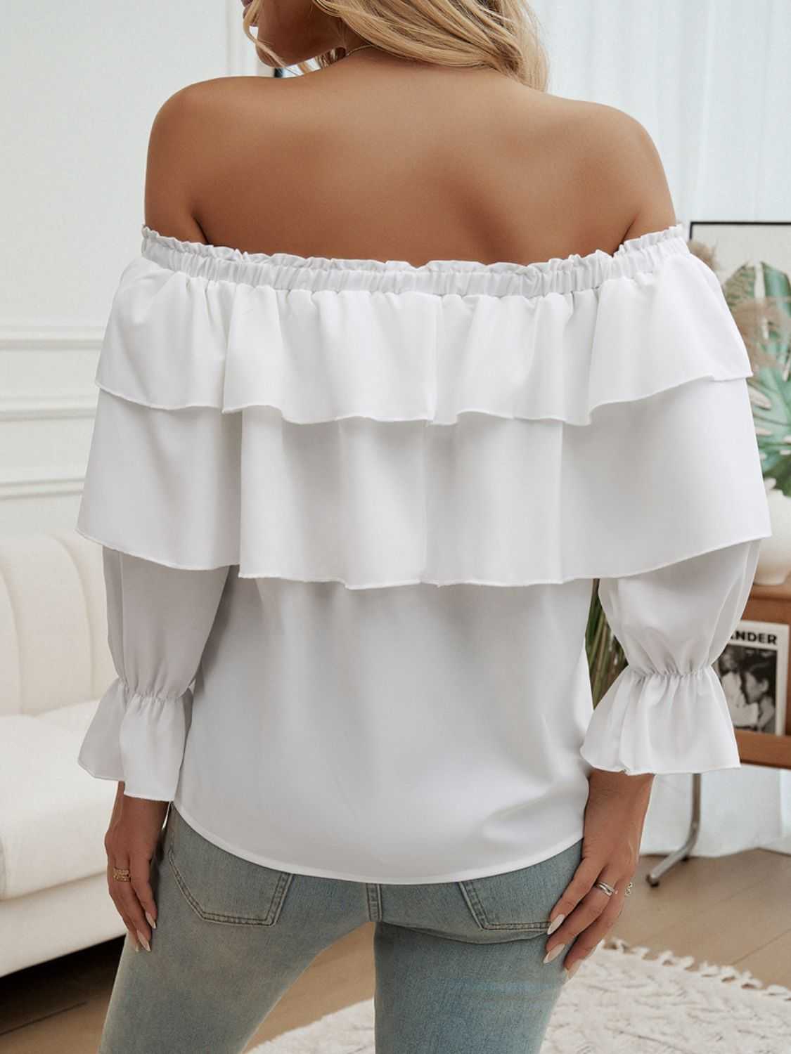 Off-shoulder flounce sleeve blouse in white with ruffled detail, made of 100% polyester.
