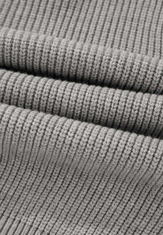Bow round neck long sleeve cardigan in ribbed fabric close-up.