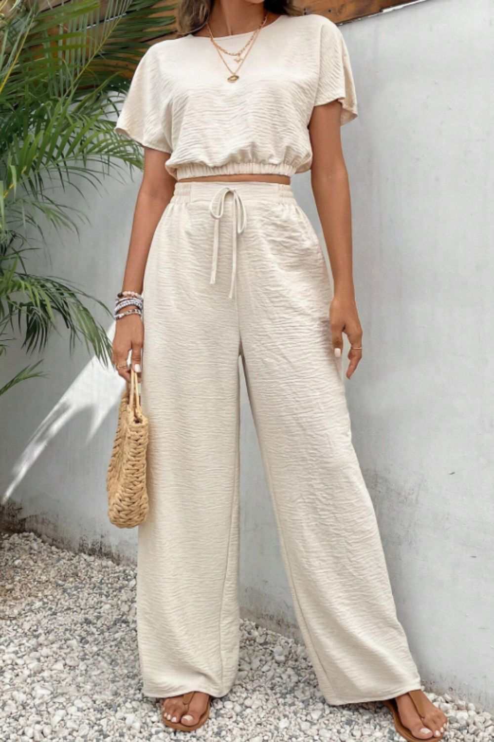 Round Neck Short Sleeve Top and Pants Set, buttoned, tied, polyester fabric, cream color, no stretch.