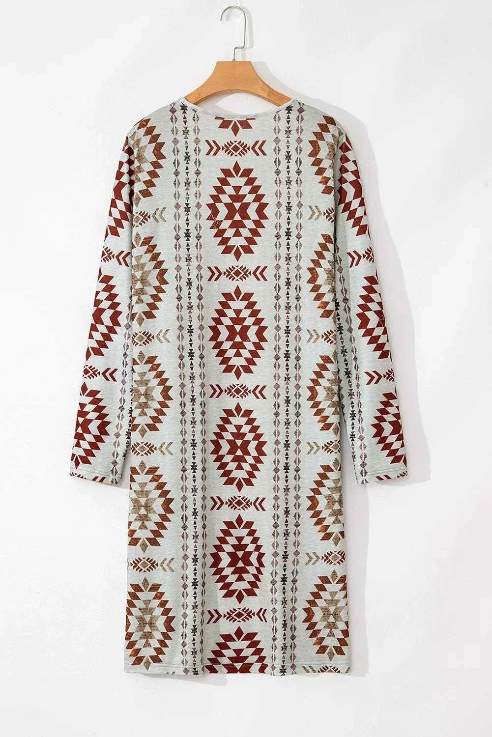 Geometric open front long sleeve cover up with red and beige patterns.