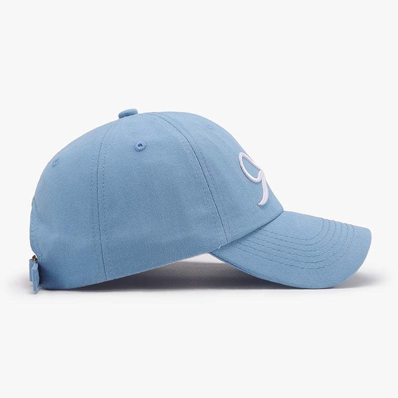 Bow embroidered cotton baseball cap in light blue.