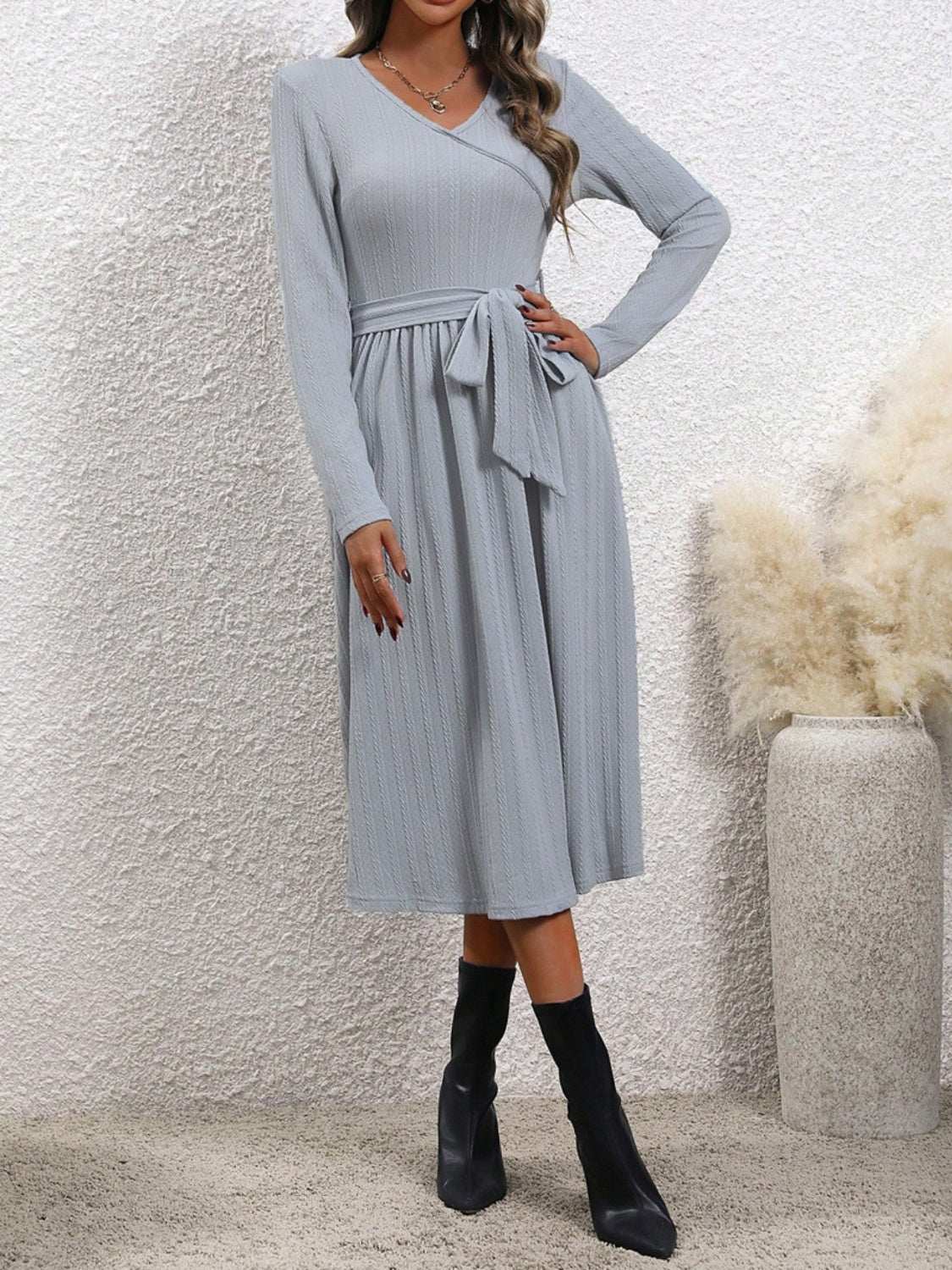 Surplice tie waist long sleeve midi dress in opaque gray with moderate stretch.