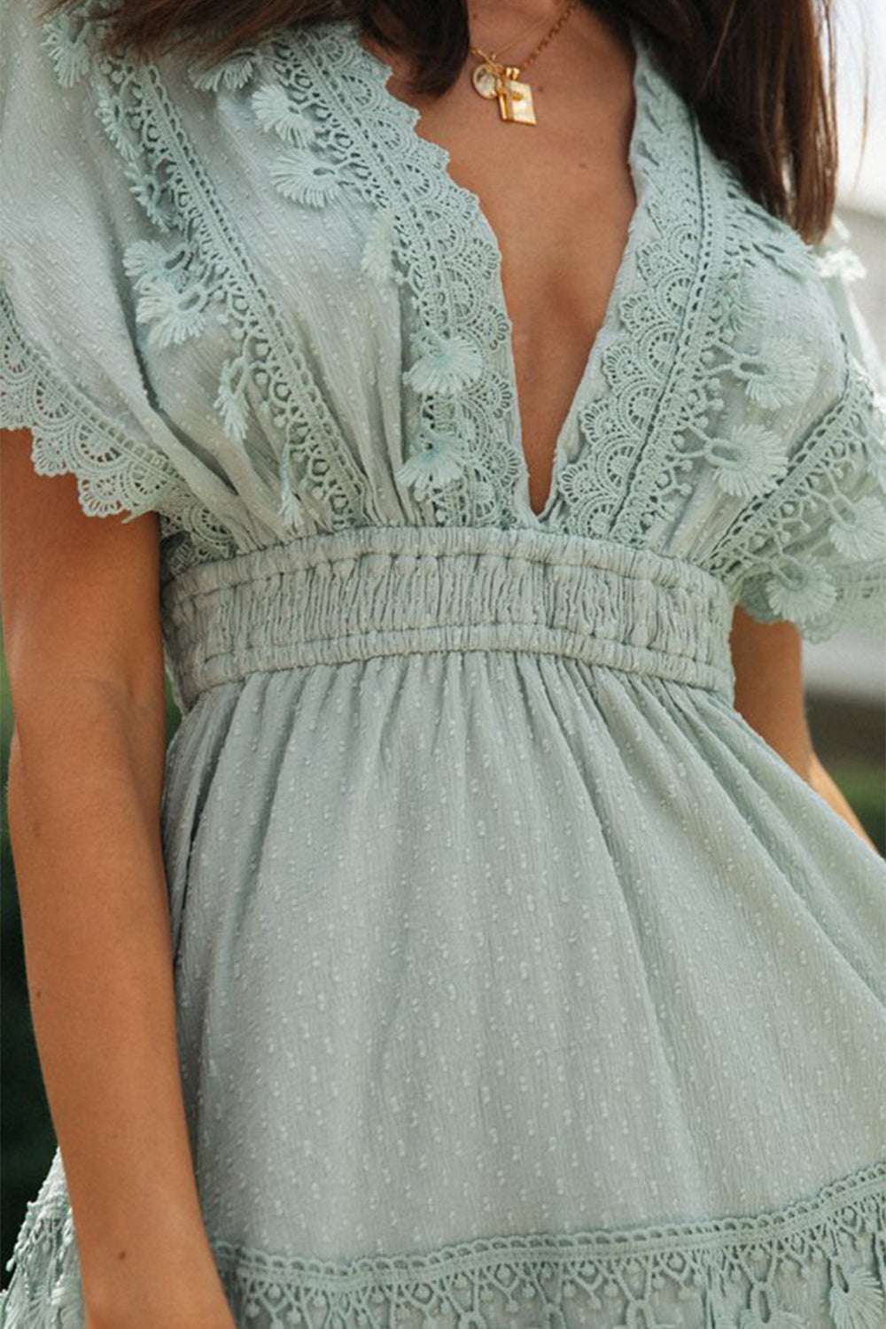 Lace detail plunge short sleeve mini dress in light fabric.