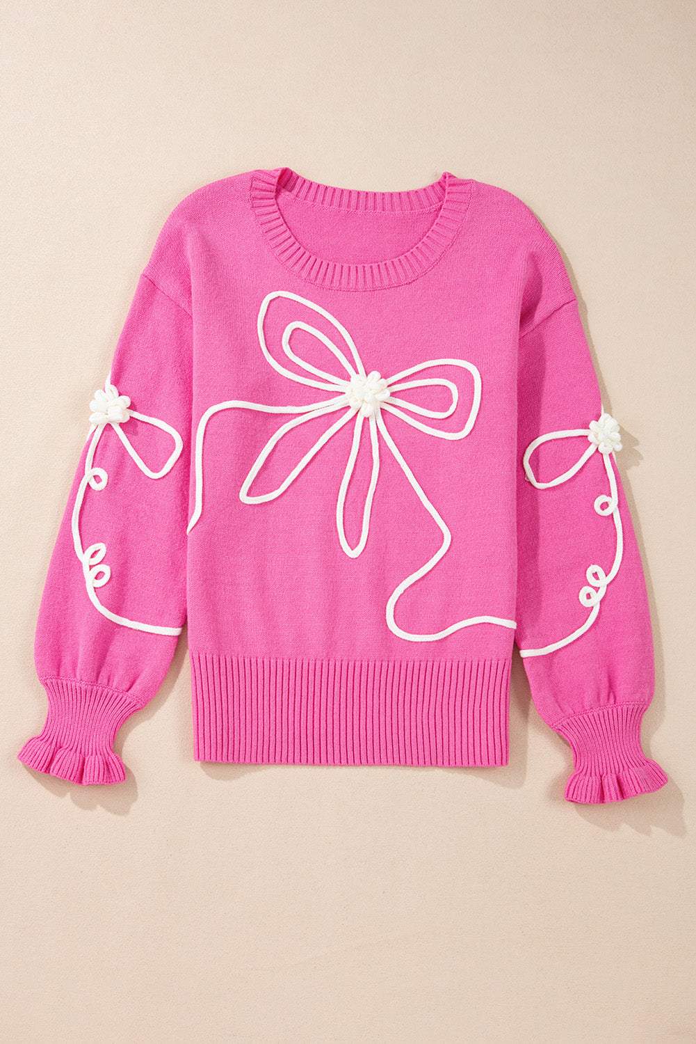 Pink bow round neck sweater with dropped shoulders and decorative white bow detailing.