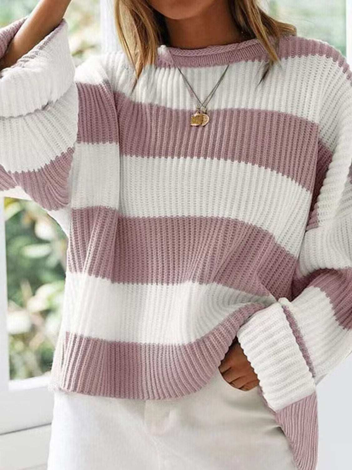 Round neck long sleeve sweater with white and mauve stripes.